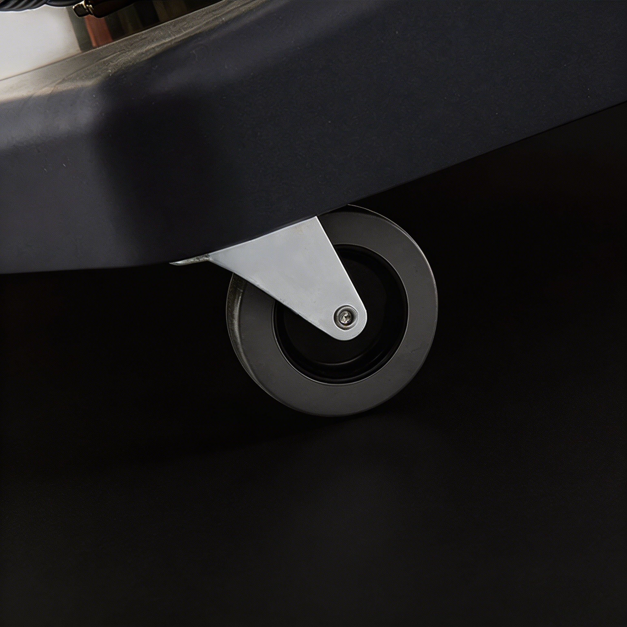 Durable caster wheels and heavy-duty base of Orbit 60 industrial vacuum cleaner